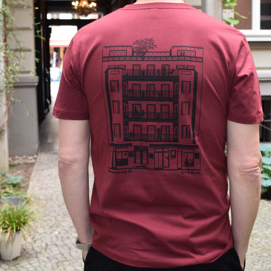 Burgundy red T-shirt featuring the GORKI logo on the front and Gorki’s building on the back